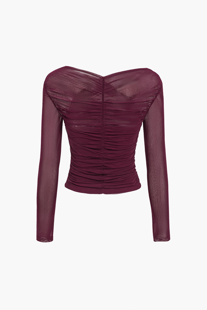 Sophisticated ruched wrap V-neck cropped long sleeve top for women, ideal for date night or evening events.