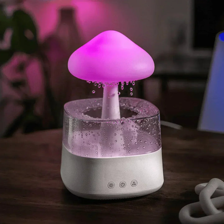 Soothing rain cloud humidifier with gentle drips & ambient night light for stress relief and calm bedroom decor.