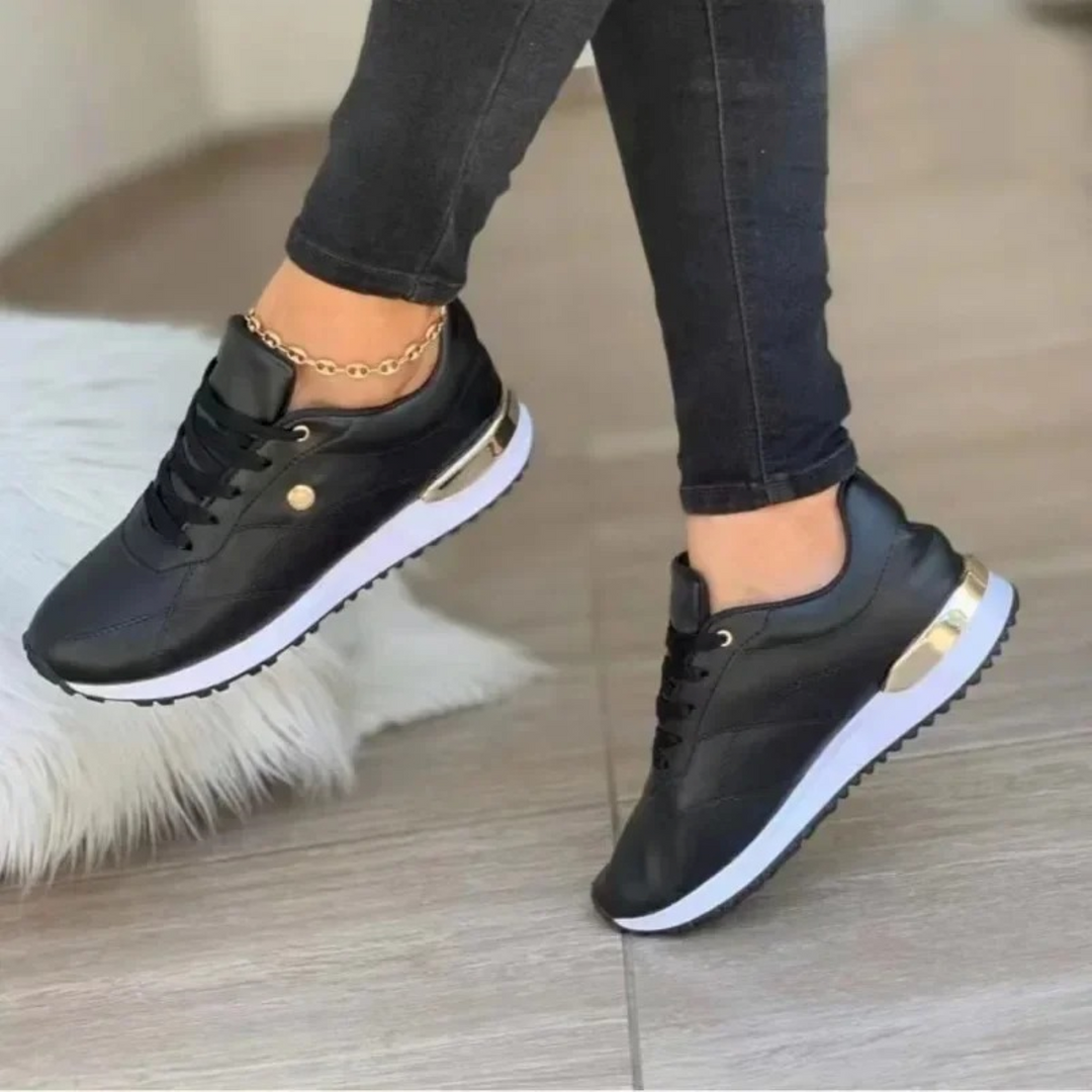 Chic Celia leather women's sneakers. Modern design for comfortable everyday footwear & versatile casual style.