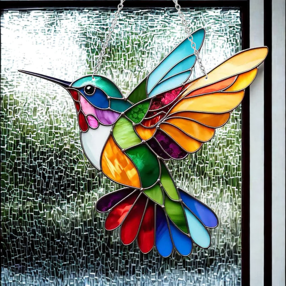 Close-up of a charming bluebird suncatcher, showing its detailed acrylic art and stained glass effect.