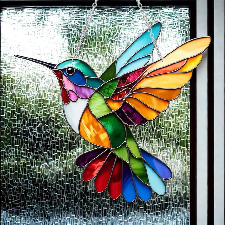 Close-up of a charming bluebird suncatcher, showing its detailed acrylic art and stained glass effect.