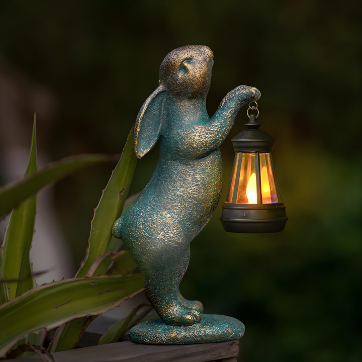 Charming bronze rabbit garden statue. Whimsical outdoor decor for patio, lawn, or garden accent. Perfect garden gift.