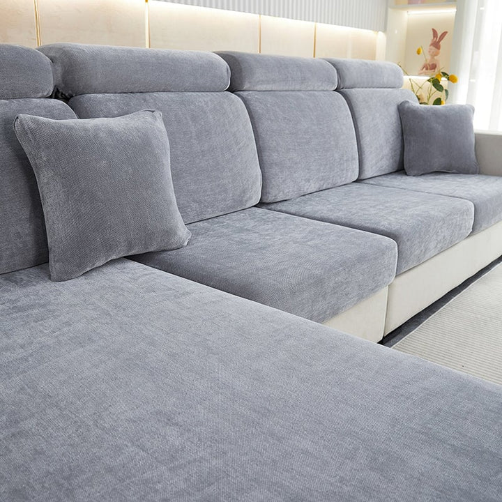 "Chenille sectional sofa cover in smoke color, fits snugly on sectional sofas to protect against wear, spills, and stains."