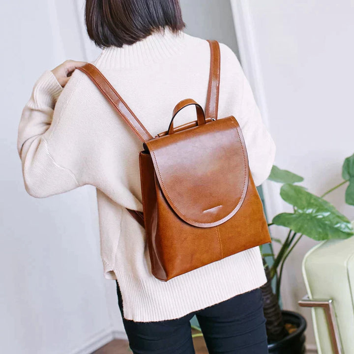 Chic genuine leather backpack for women, stylish and versatile everyday travel bag.