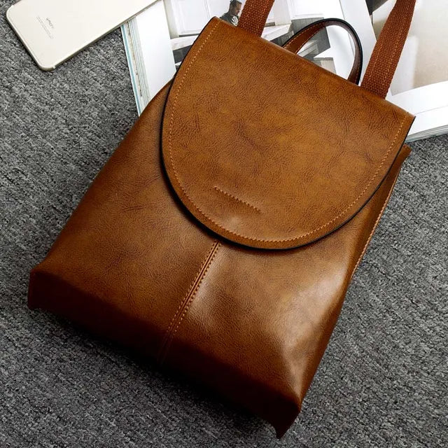 Versatile black leather backpack for women, a fashion accessory designed for daily commutes & travel.