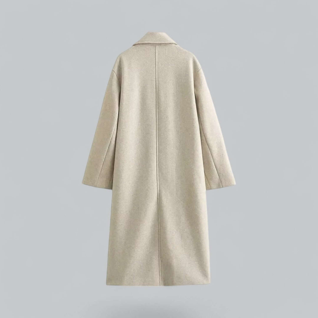 Long elegant women's winter coat. Stylish oversized buttoned outerwear, sophisticated look.
