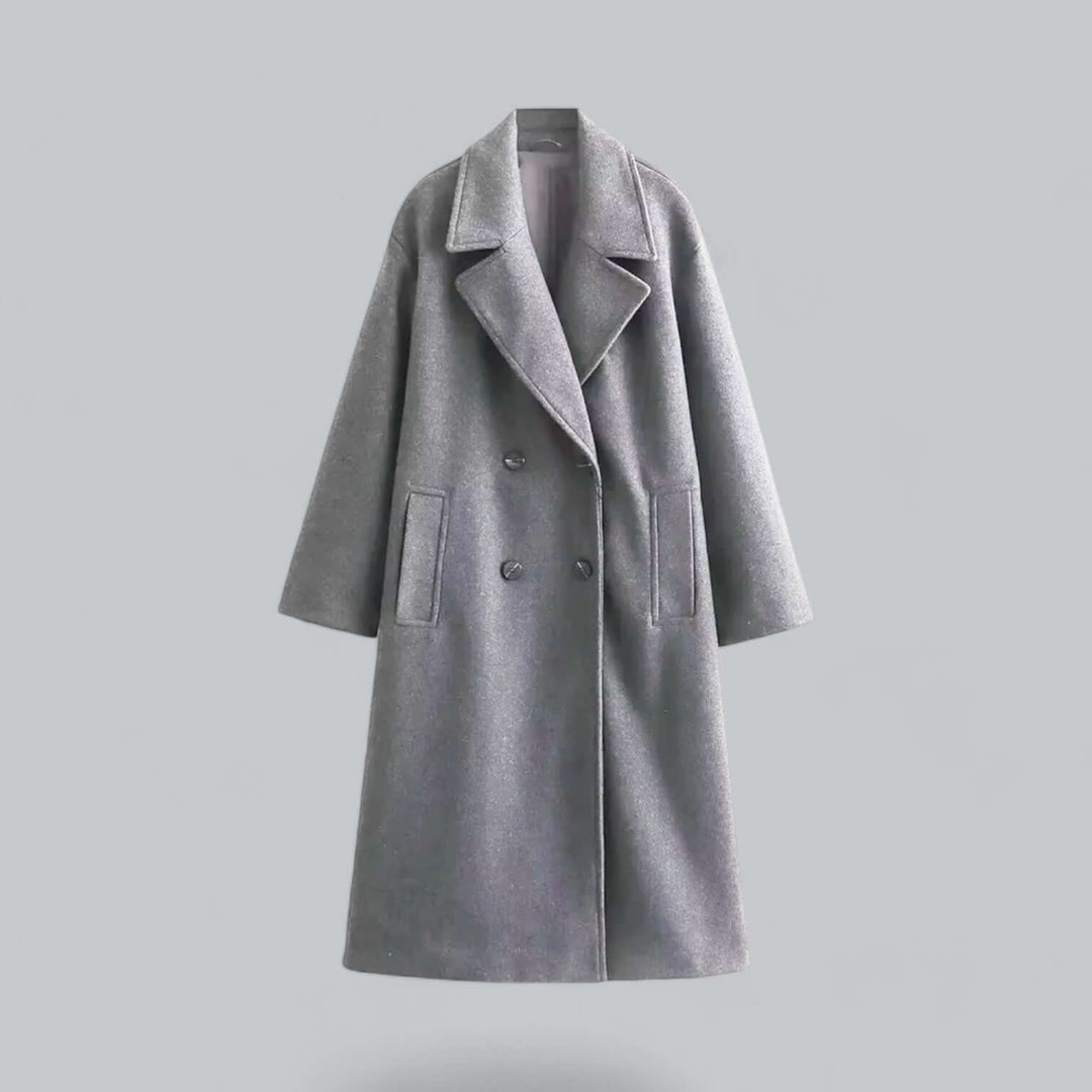 Sophisticated oversized women's coat with buttons. Chic, long, and elegant outerwear.