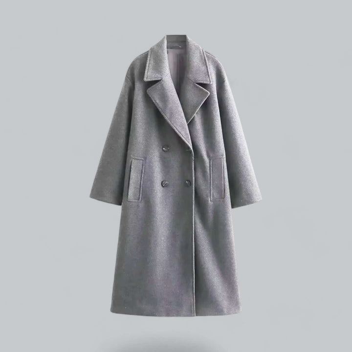 Sophisticated oversized women's coat with buttons. Chic, long, and elegant outerwear.