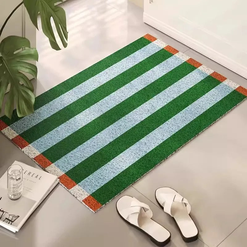 Durable PVC striped outdoor mat, anti-slip & easy clean floor mat for any entryway. Modern home accent.