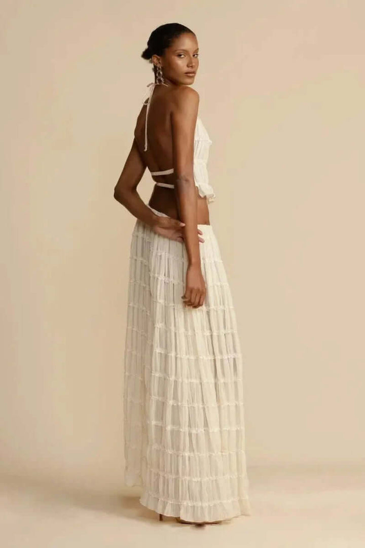 Trendy women's white halter top and mini skirt. This sleeveless short skirt set is perfect for summer events.