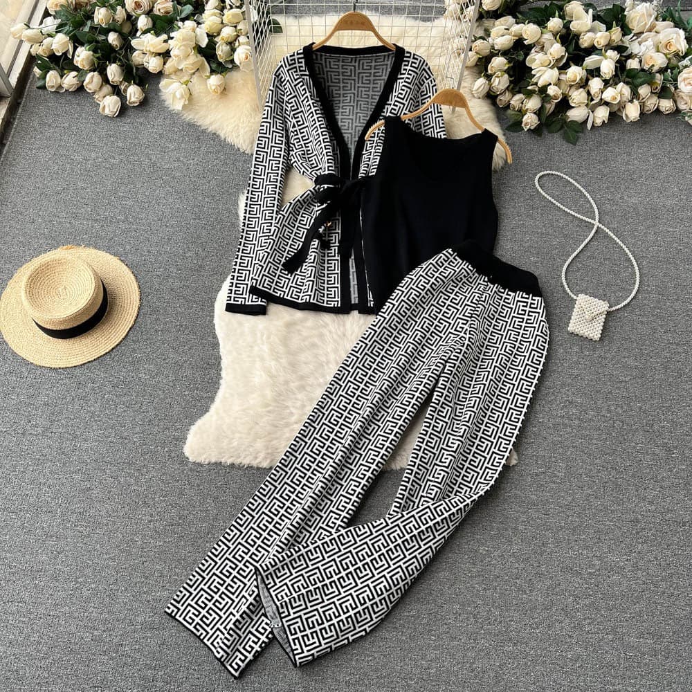 Stylish women's knit 3-piece set in acrylic blend: elegant sweater, open cardigan, and comfortable pants.