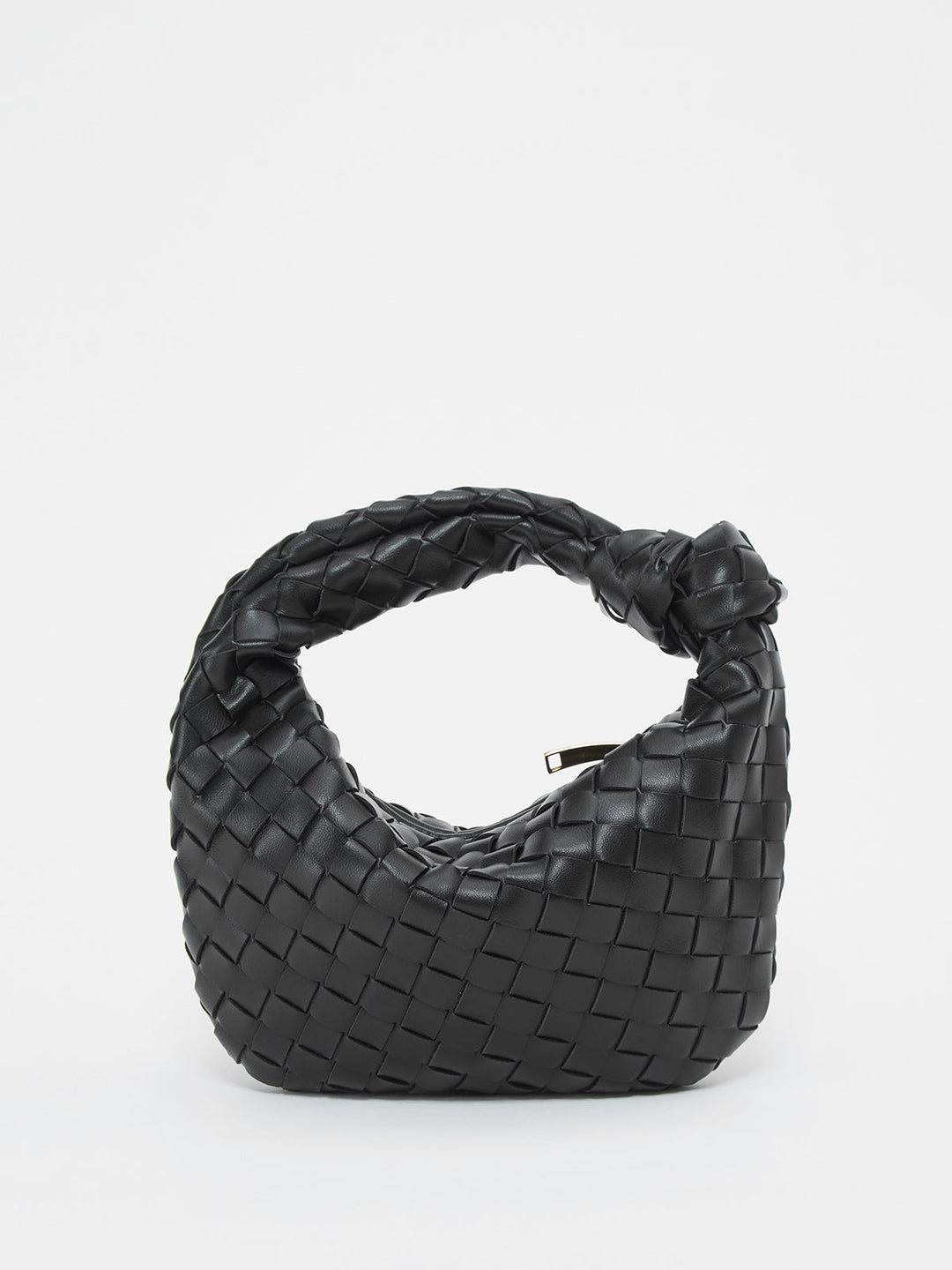 Textured women's shoulder bag with unique braided knot handle, a modern chic handbag statement.