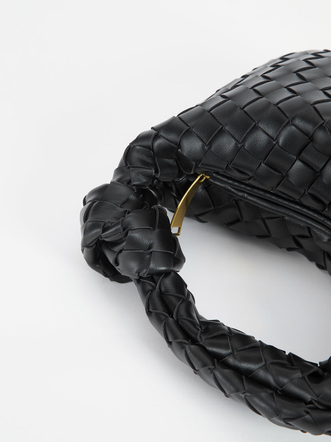 Elegant women's shoulder bag with stylish braided knot handles, a versatile and textured handbag accessory.