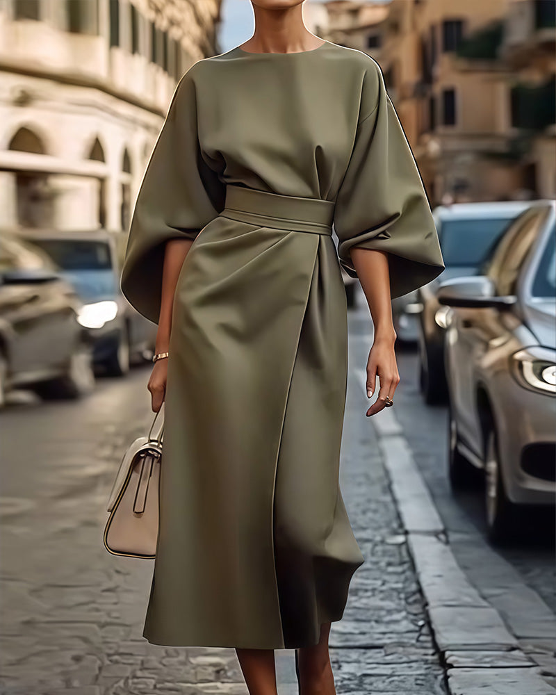 Fashionable women's olive green midi dress with puff sleeves, a versatile & elegant spring/summer style.
