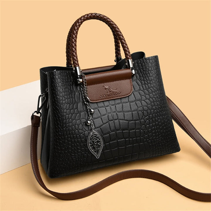 Timeless black women's handbag. Elegant everyday tote, a chic and durable fashion accessory.