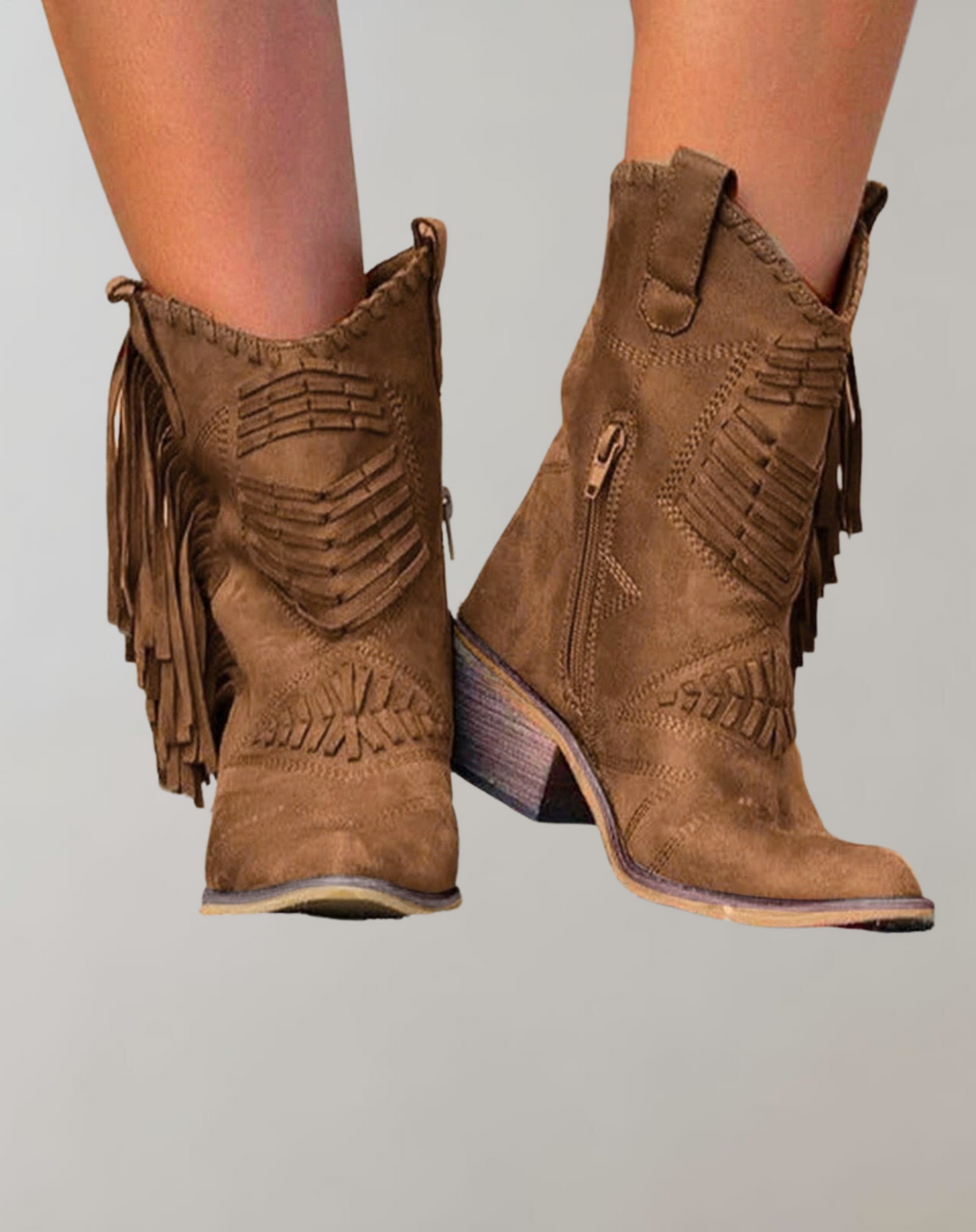 Elegant women's tassel ankle boots, versatile chic footwear for casual or dressy fall outfits.