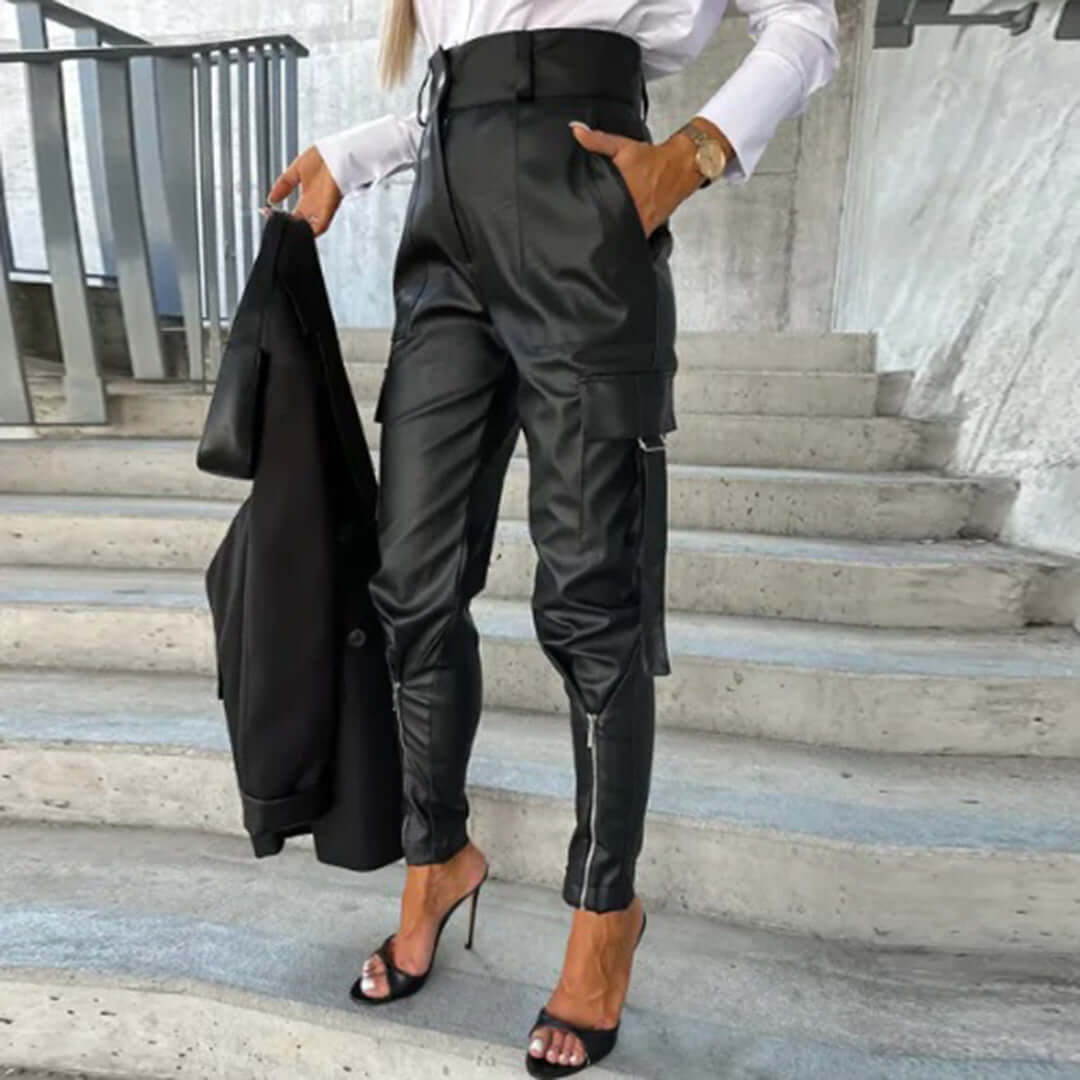 Chic women's faux leather cargo trousers, high-waisted with a tapered leg. Edgy & versatile fashion bottoms.