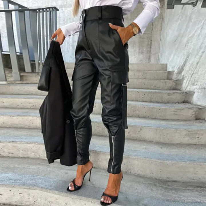 Chic women's faux leather cargo trousers, high-waisted with a tapered leg. Edgy & versatile fashion bottoms.