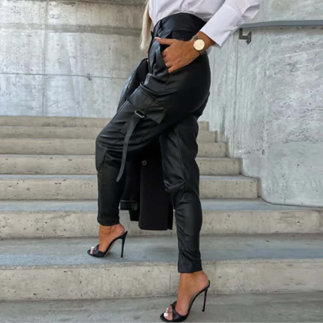 Stylish dark brown faux leather cargo trousers, high-waisted and tapered. Chic women's fashion pants.