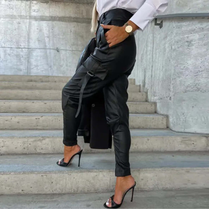 Stylish dark brown faux leather cargo trousers, high-waisted and tapered. Chic women's fashion pants.