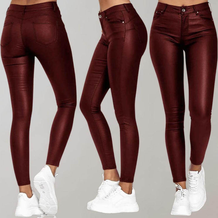 Women's sleek faux leather pants, comfortable & chic. High-waisted slim fit for versatile, elegant fashion.