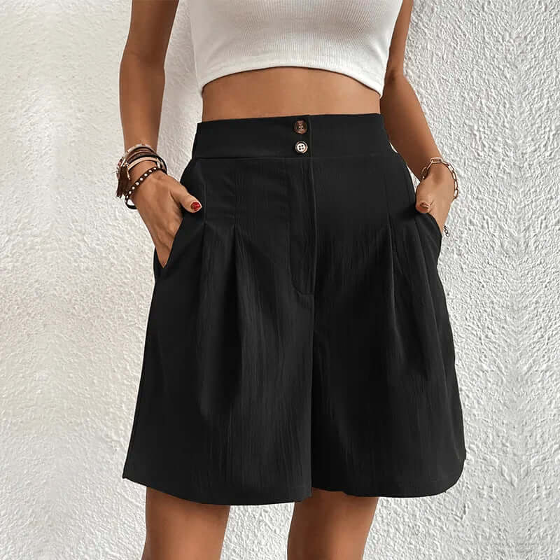 Chic women's high-waisted pleated shorts. Elegant and flattering, perfect for summer fashion and comfortable wear.