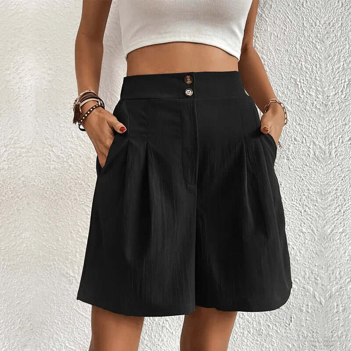 Chic women's high-waisted pleated shorts. Elegant and flattering, perfect for summer fashion and comfortable wear.