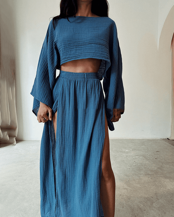 Casual chic women's off-shoulder top & high-waist maxi skirt set. Versatile two-piece summer outfit.