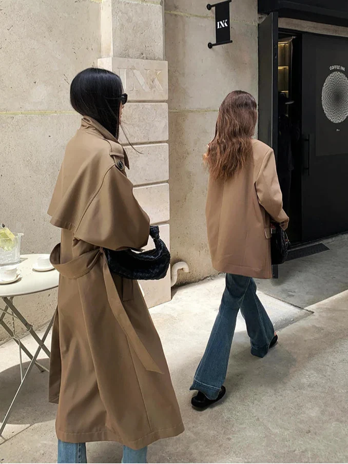 Sophisticated women's oversized long trench coat, essential for a stylish wardrobe.