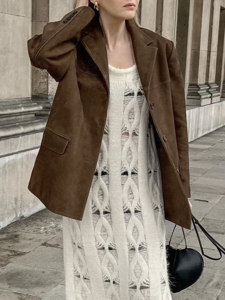Stylish oversized suede jacket for women. Fashionable button-front design, perfect as chic casual or workwear outerwear.