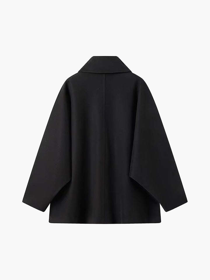 Modern women's oversized coat offering chic style & comfort. Relaxed fit winter outerwear, great for layering.