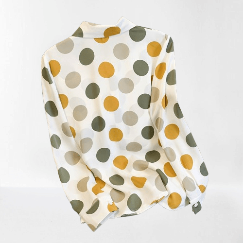 Stylish women's long sleeve polyester button-up shirt featuring a classic polka dot pattern. Perfect for fashion.