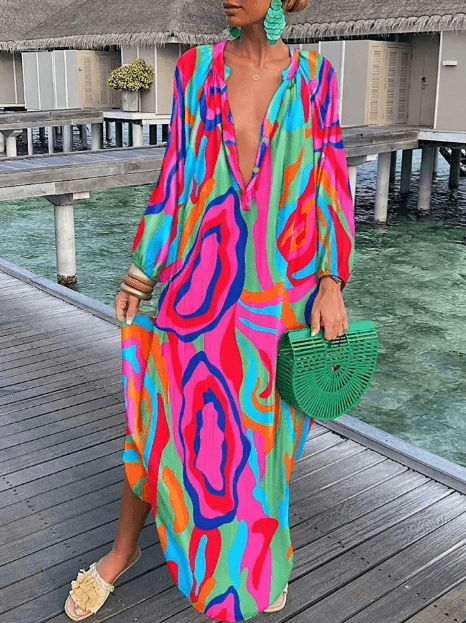 Comfortable women's sleeveless midi dress with a vibrant summer print, perfect for beachwear or vacation.