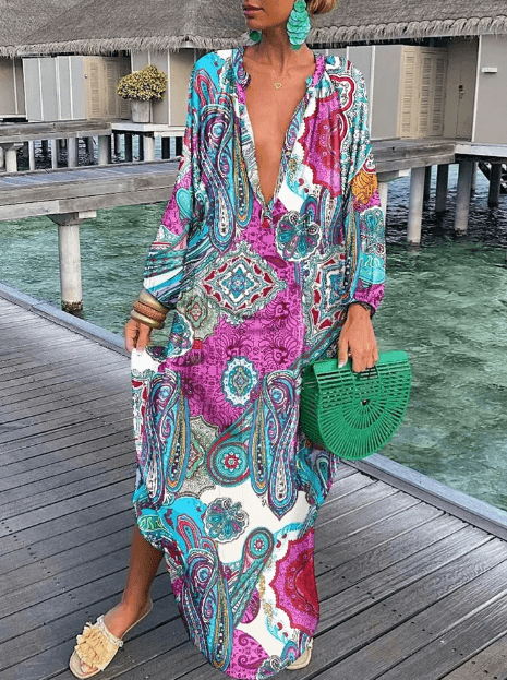 Breezy women's sleeveless midi dress with a beautiful summer print, perfect for warm weather and beach trips.