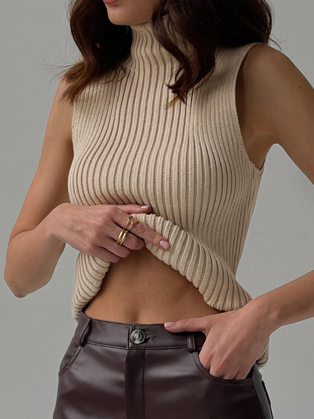 Chic women's ribbed knit sleeveless top with mock neck, perfect for summer fashion & versatile layering.