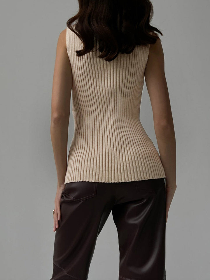 Elegant sleeveless ribbed knit top for women. Versatile mock neck design, ideal for casual or dressy outfits.