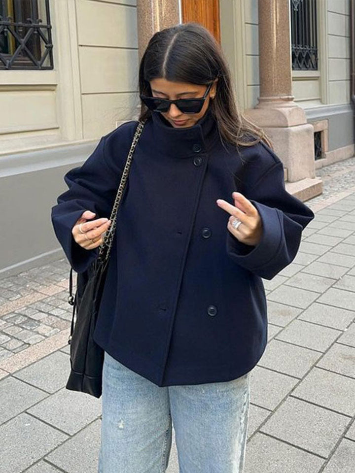 Chic women's short double-breasted jacket in a versatile style, perfect for fall & winter fashion. Elegant outerwear.