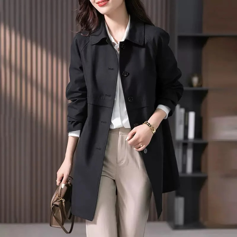 Classic women's single-button short trench coat, a chic and elegant jacket perfect for modern fall fashion.