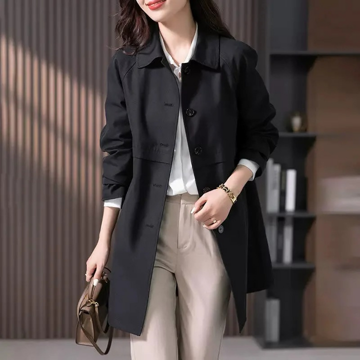Classic women's single-button short trench coat, a chic and elegant jacket perfect for modern fall fashion.