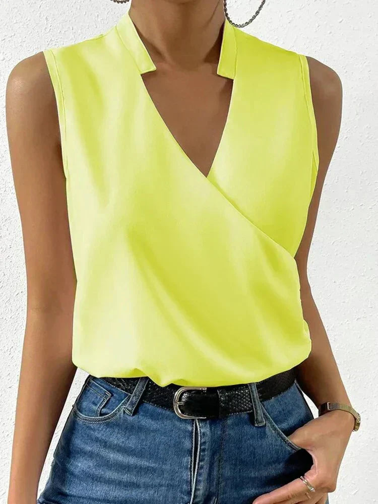 Chic women's sleeveless summer blouse. Versatile top, perfect for casual or elegant spring/summer outfits.