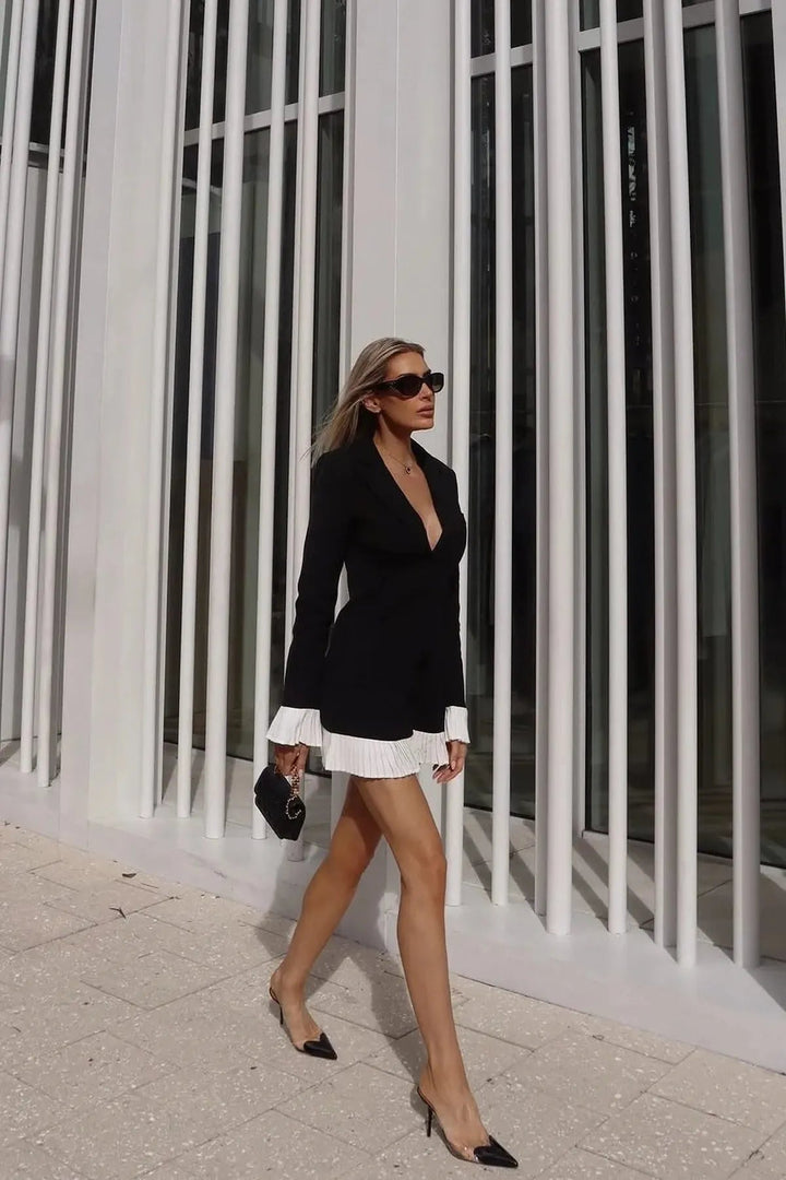 Elegant women's pleated mini dress, V-neck, button front. Sophisticated chic style for cocktail or day events.