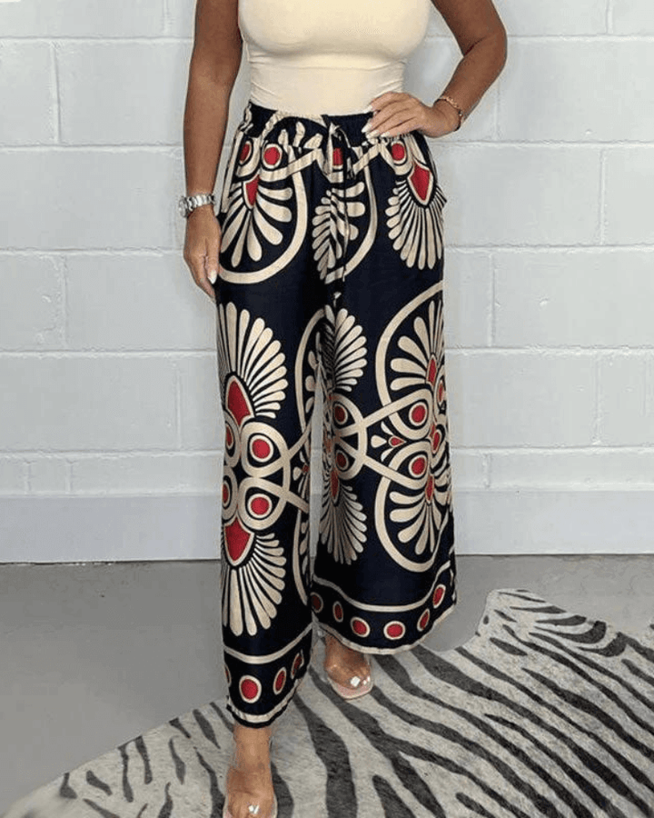 Comfortable flowing wide-leg printed pants for women, ideal for relaxed spring & summer casual wear.
