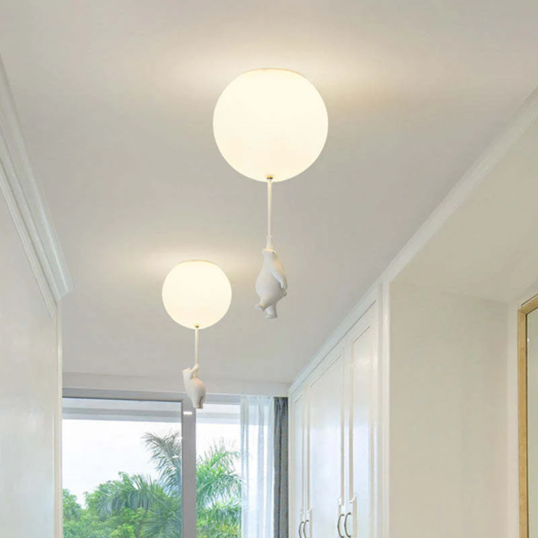 Unique bear holding balloon design LED pendant light for a magical nursery ambiance.