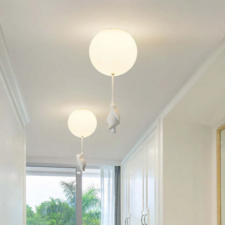 Unique bear holding balloon design LED pendant light for a magical nursery ambiance.