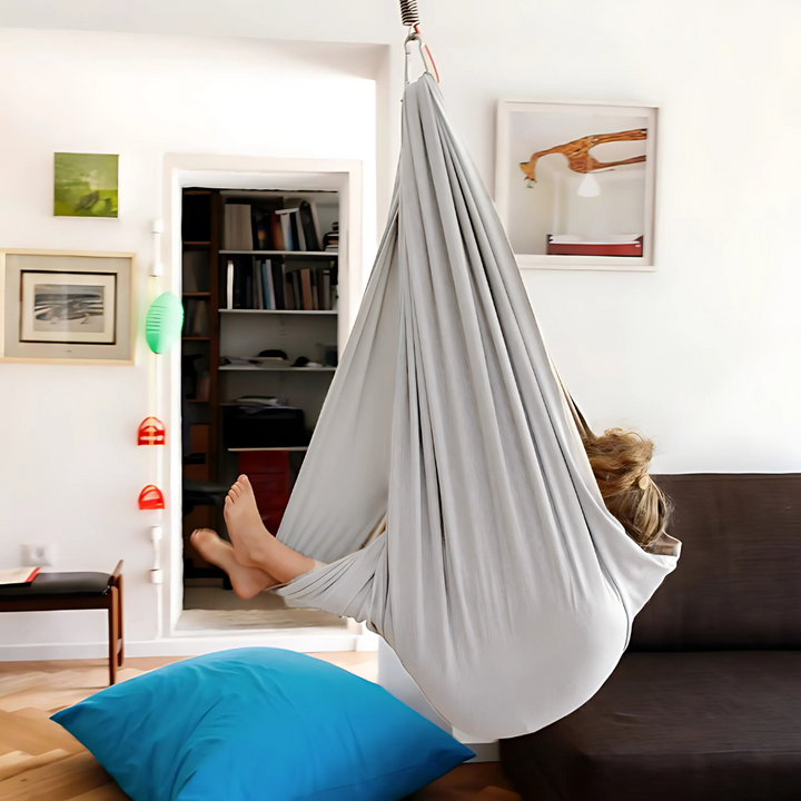 Comfortable sensory hammock swing for children's calm and play. Supports sensory integration & relaxation.