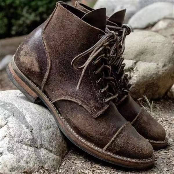 Classic brown men's leather ankle boots, comfortable and versatile for casual wear, durable mens footwear.