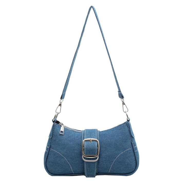 Versatile women's dark blue shoulder handbag with buckle closure, can be worn two ways.