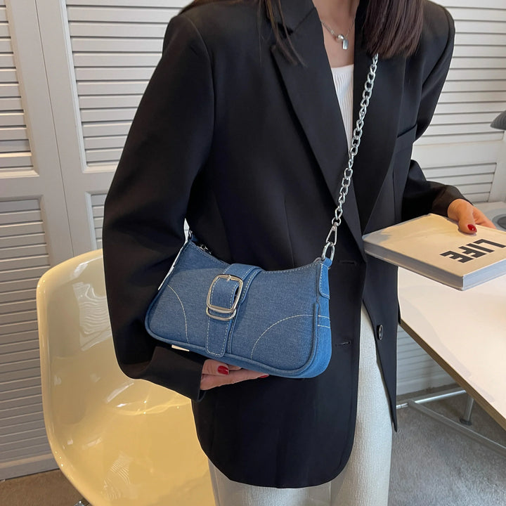 Women's classic blue buckle shoulder handbag, a chic two-way design for versatile everyday wear.