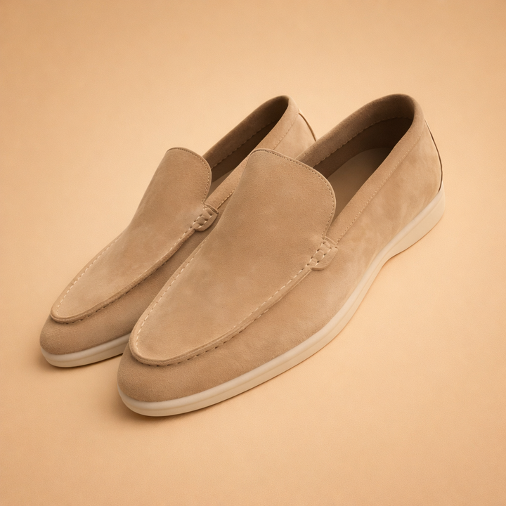 Stylish men's leather penny loafers in a rich tan color, perfect for versatile year-round fashion.