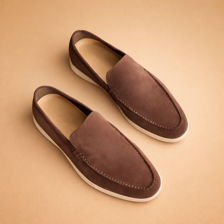 Men's elegant black slip-on penny loafers, perfect for adding a touch of sophistication to any outfit.